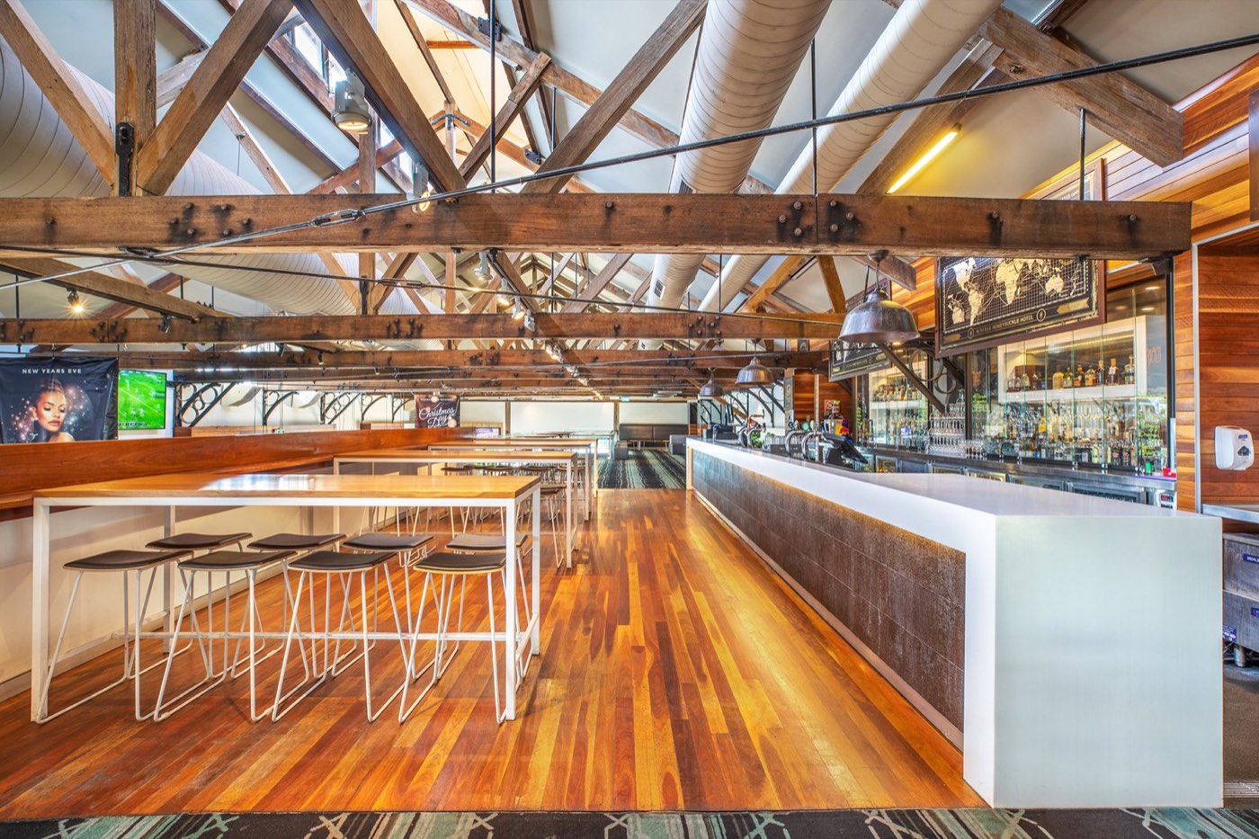 Exposed timber trusses and bar at the Honeysuckle Hotel, painted by John Hersee Master Painters