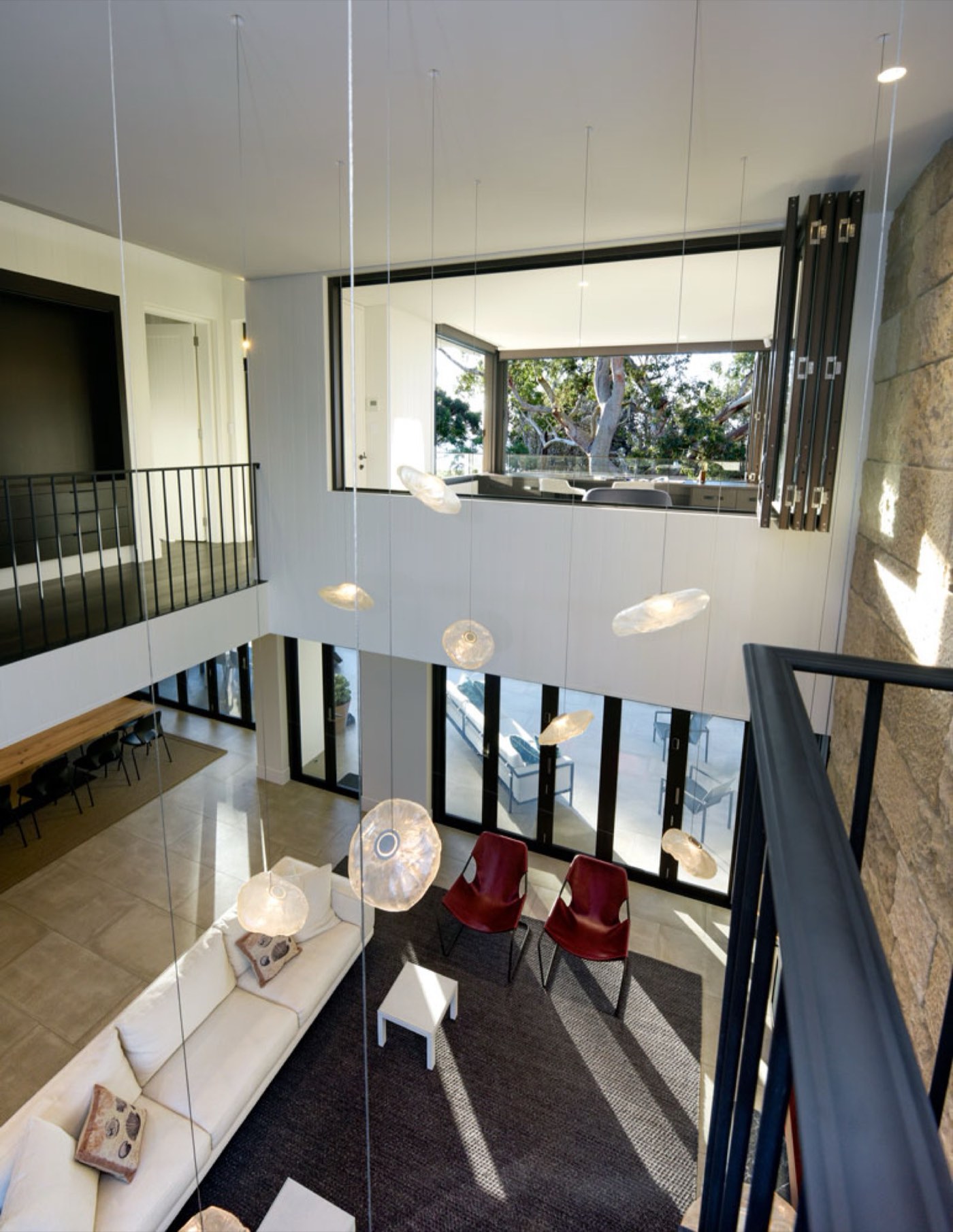 Double-height living interior of the Corlette residence, finished by John Hersee Master Painters
